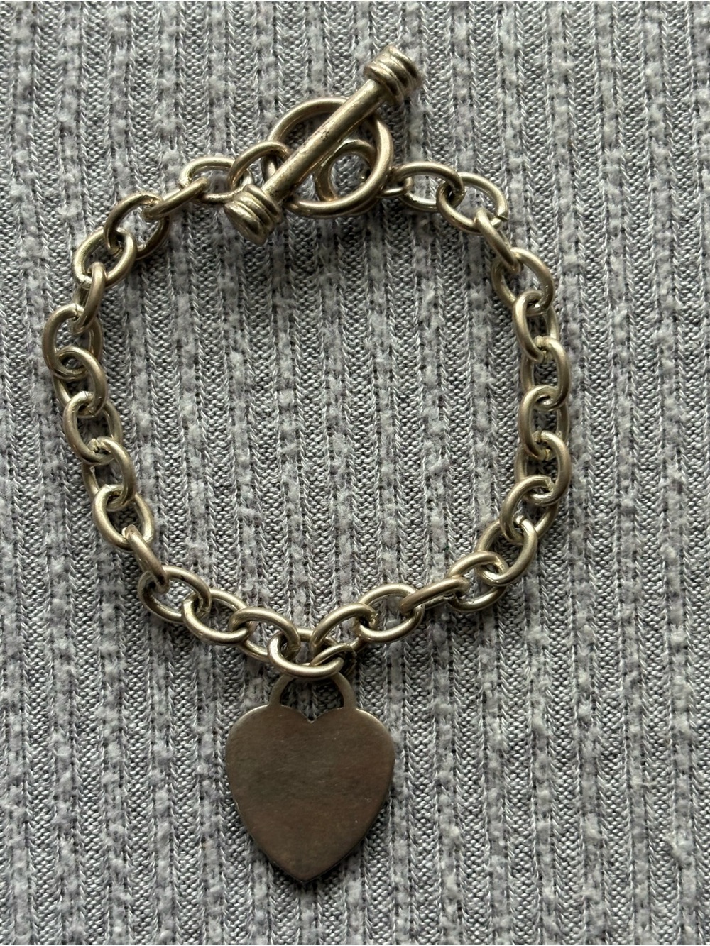 Vintage silver tone heart pendant on clasped chain bracelet